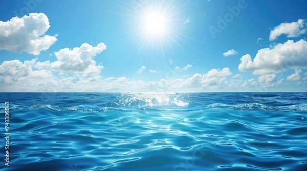 Fototapeta A tranquil blue ocean scene basking under the radiant sunshine, illustrating calmness and vastness of the sea