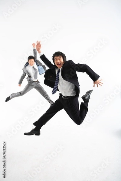 Obraz 스튜디오에서 점프를 하는 두 명의 비즈니스맨