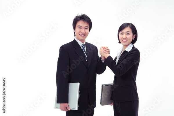 Obraz 손을 맞잡고 카메라를 쳐다보는 비즈니스 여성과 남성