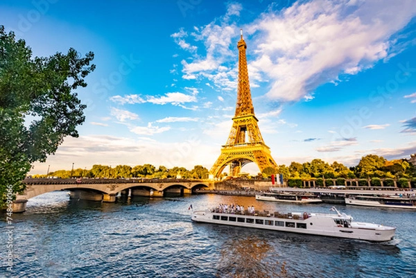 Fototapeta Scenic panorama of Eiffel Tower, Seine River, and pont d'lena in Paris, France
