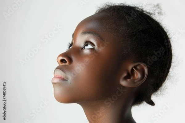 Fototapeta A woman with her eyes closed looking up. Suitable for meditation or relaxation concepts
