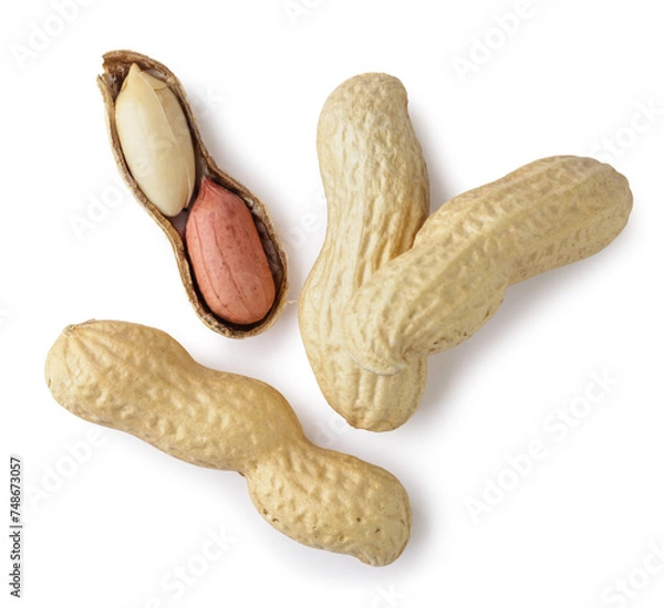 Fototapeta Peanuts in shell and kernel on a white background. Top view