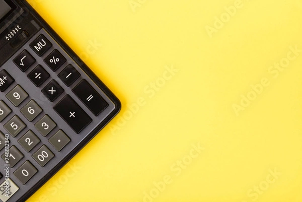 Fototapeta Modern calculator, Business and Finance accounting concept on yellow background with space for text.