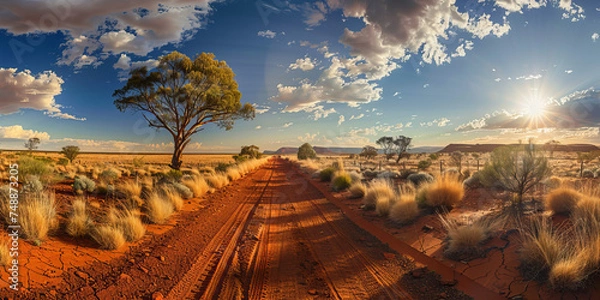 Obraz Expansive Australian outback landscape with a long dirt road leading into a breathtaking sunset and dynamic sky