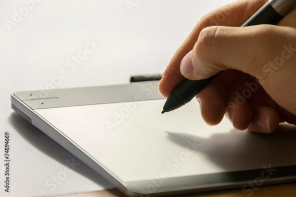 Fototapeta Close-up of a graphic tablet with his pen tool