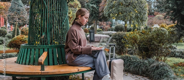 Fototapeta Business travel.Remote work. freelancer works remotely business travel.workation,remotely work,work life balance,digital nomad,workation,work travel,remot work.Travelling.Work from vacation remotely