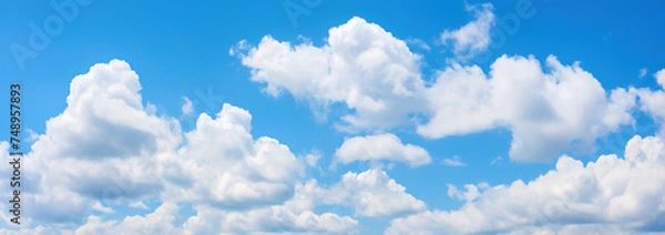 Fototapeta Scenic and Beautiful Bright blue sky with puffy clouds on a clear sunny day