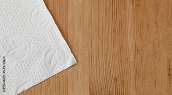 Obraz White paper napkin on wooden surface