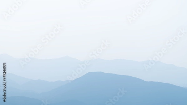 Fototapeta Landscape of mountain range with fog in morning. Natural background.
