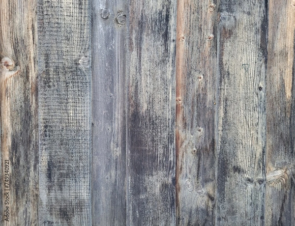 Obraz background of old wooden fence panels, faded from the sun and darkened from excess moisture