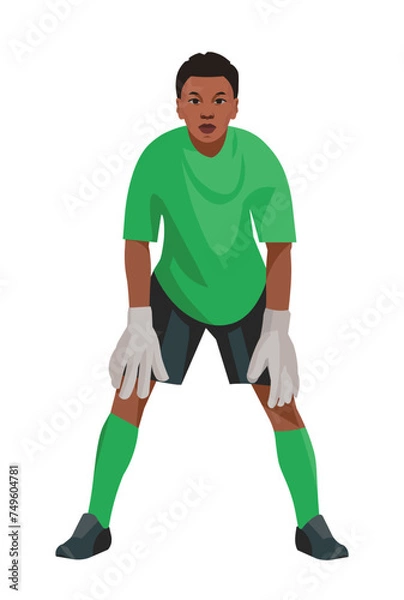 Obraz Angolan teenage boy goalkeeper of junior football teem in green uniform and gloves who stands upright in goal and waits for the ball