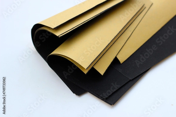 Obraz Black sandpaper on a white background.
