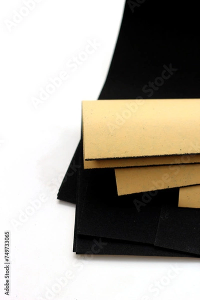 Obraz Black sandpaper on a white background.