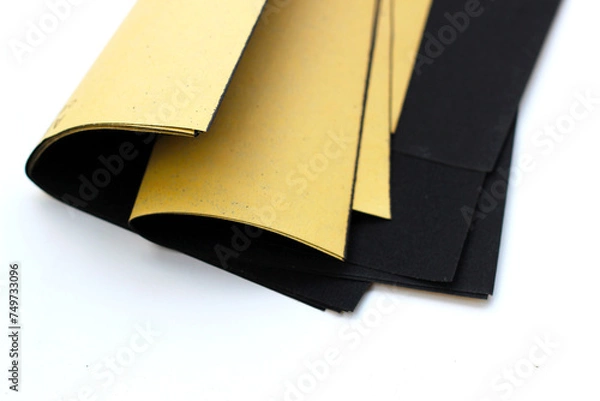 Obraz Black sandpaper on a white background.