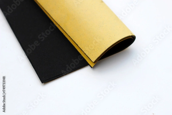 Obraz Black sandpaper on a white background.