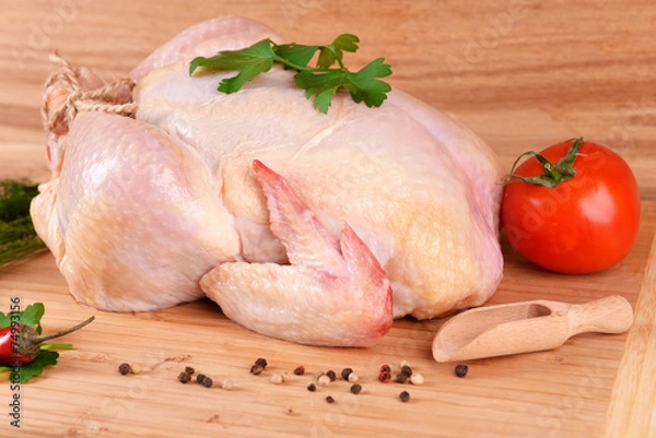 Obraz Raw chicken on wooden table