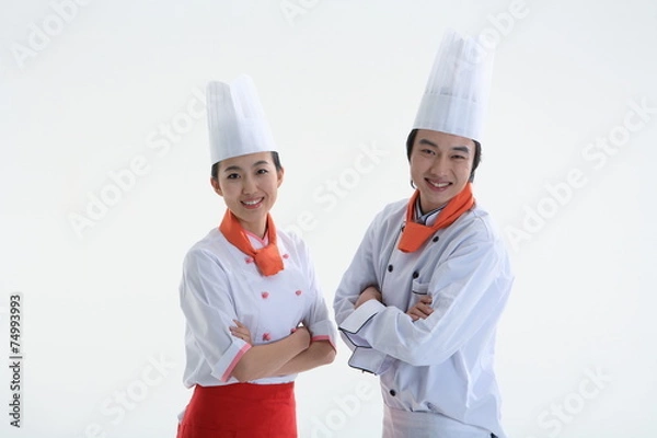Fototapeta 스튜디오 안의 요리중인 남자요리사와 여자요리사