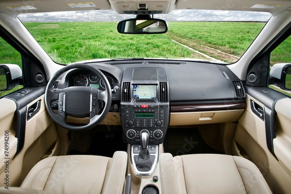 Obraz Sand colored SUV car interior in the fields
