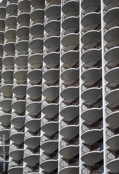 Fototapeta Stack of Identical Patios on a Skyscraper Wall.