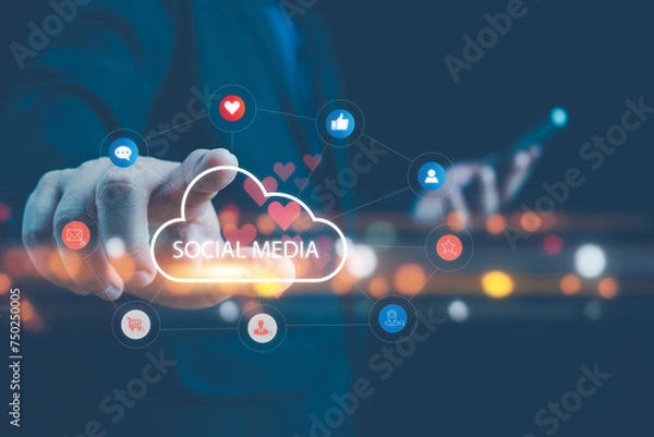 Fototapeta Businessman holding a cloud of social media network icon, Social media and digital online concept, using smart phone. The concept of living on vacation and playing social media. Social media concept.