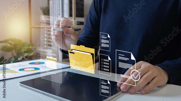 Fototapeta Document Management System (DMS),Businessman using a laptop searching folder and managing files paperwork.Software for archiving,share online database server, administration employee in enterprise.