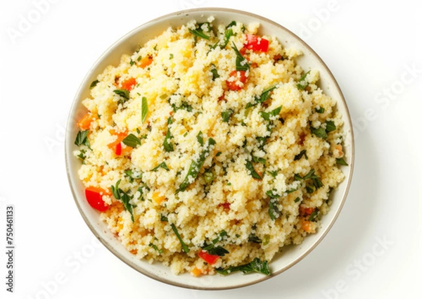 Fototapeta Tabbouleh salad with couscous, fresh parsley, and diced tomatoes in a bowl, top view isolated on white background. Middle Eastern cuisine concept