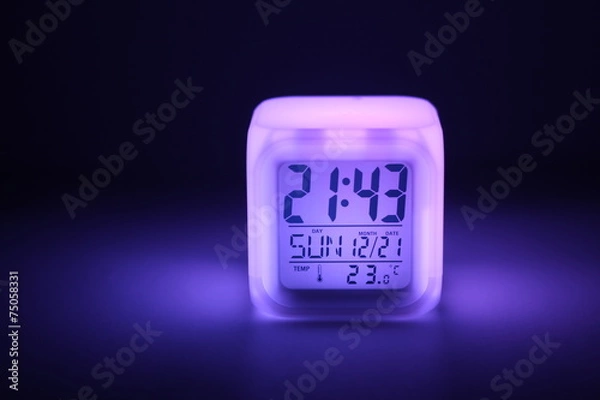 Obraz Clocks  with colored lighting at the night.