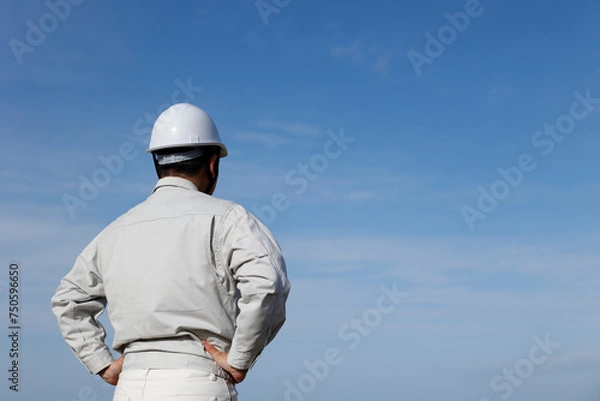 Obraz 作業着を着た男性の後ろ姿