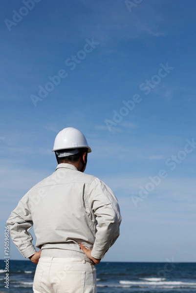 Fototapeta 作業着を着た男性の後ろ姿