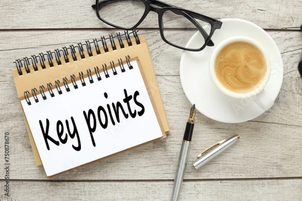 Fototapeta glasses and a cup of coffee on the work table. text Key Points