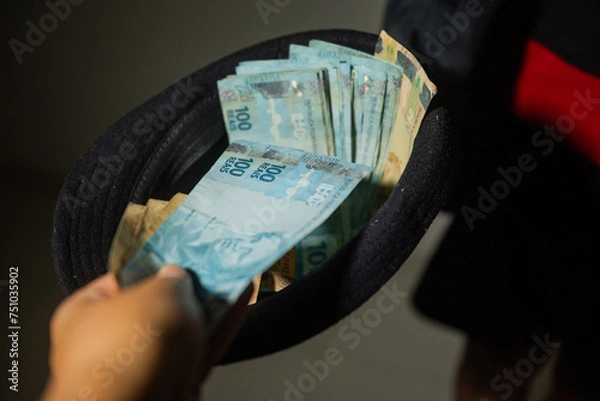 Fototapeta The picture represents cases of corruption and bribery in many different cases such as politics, football, business in Brazil, Europe and the USA. This could be in dollar, euro or brazilian real.