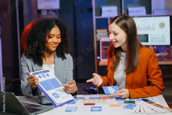 Fototapeta businesswoman and woman people meeting in office. Employee brainstorm and work as team, plan and discuss project by point on paper and