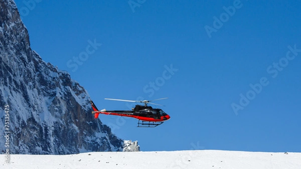 Fototapeta Lifeguard helicopter in Himalaya mountains in Nepal