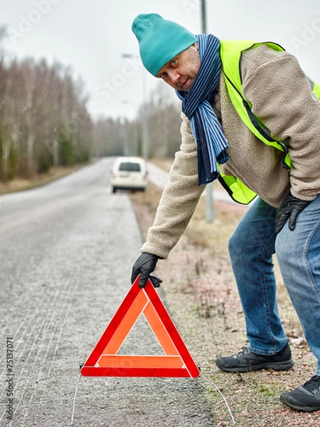 Obraz Male and warning triangle