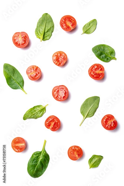 Fototapeta food background cherry tomatoes and spinach leaves isolated on white background.