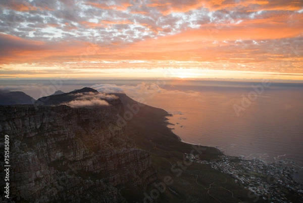 Fototapeta A view of Camp's Bay from Table Mountain, at sunset, looking over the suburba nd the ocean. Situated in Cape Town, South Africa