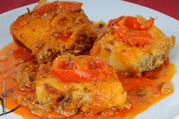 Obraz Fish dish with onions and peppers sauce