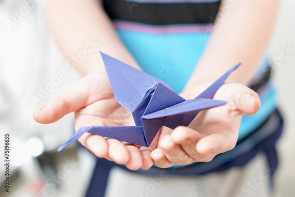 Obraz Origami crane in children's hands