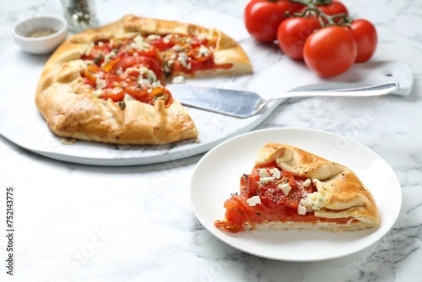 Obraz Tasty galette with tomato and cheese (Caprese galette) on white marble table, closeup
