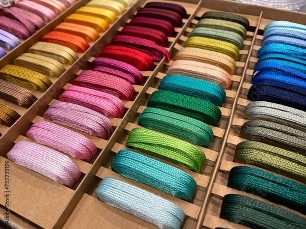 Obraz Colorful ribbon or multicolored shoelaces display, perspective view.