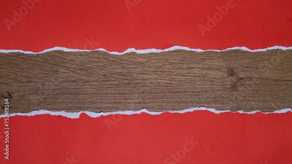 Fototapeta Torn red paper sheet isolated on wooden texture background