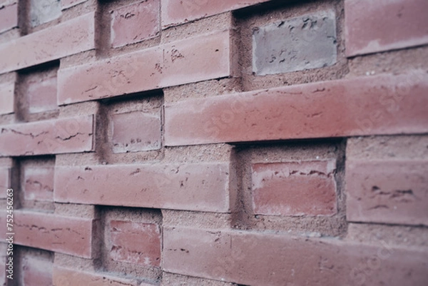 Fototapeta Backsteinmauer mit strukturierter Formation.