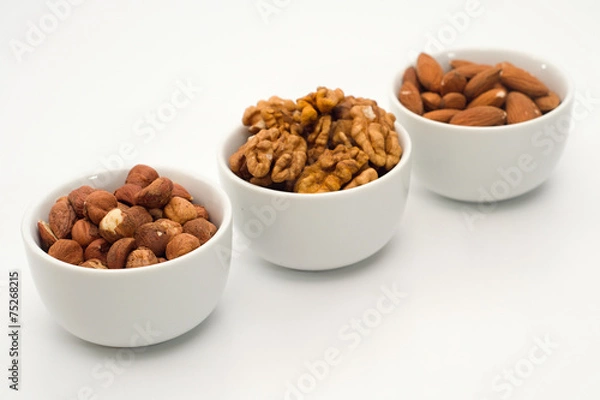 Fototapeta Mix of nuts in the bowls