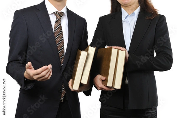 Obraz 難しい本を読んで調べている男女の二人のビジネスマン