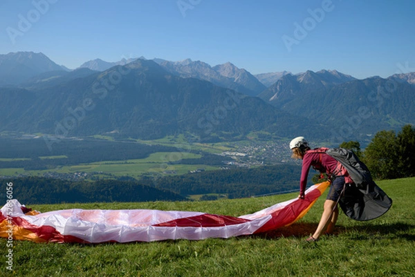 Obraz Paragliding pilot make the equipment ready