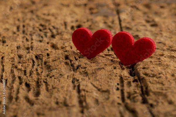 Fototapeta red hearts on a wooden surface