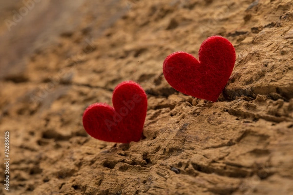 Fototapeta red hearts on a wooden surface