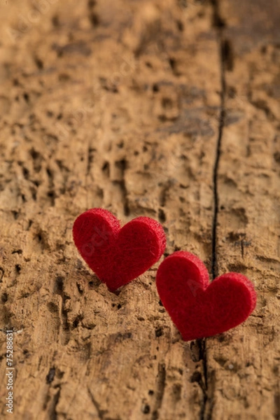 Fototapeta red hearts on a wooden surface