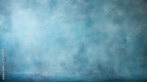 Obraz Dusty blue blurred background for portrait. Portrait backdrop for studio. Empty textured wall.