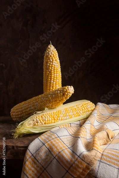 Obraz Several cobs sweet corn on wooden background..